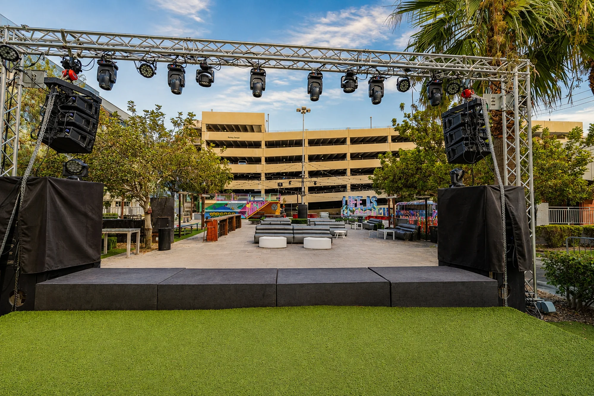 The Courtyard stage on the turf under downtown towers