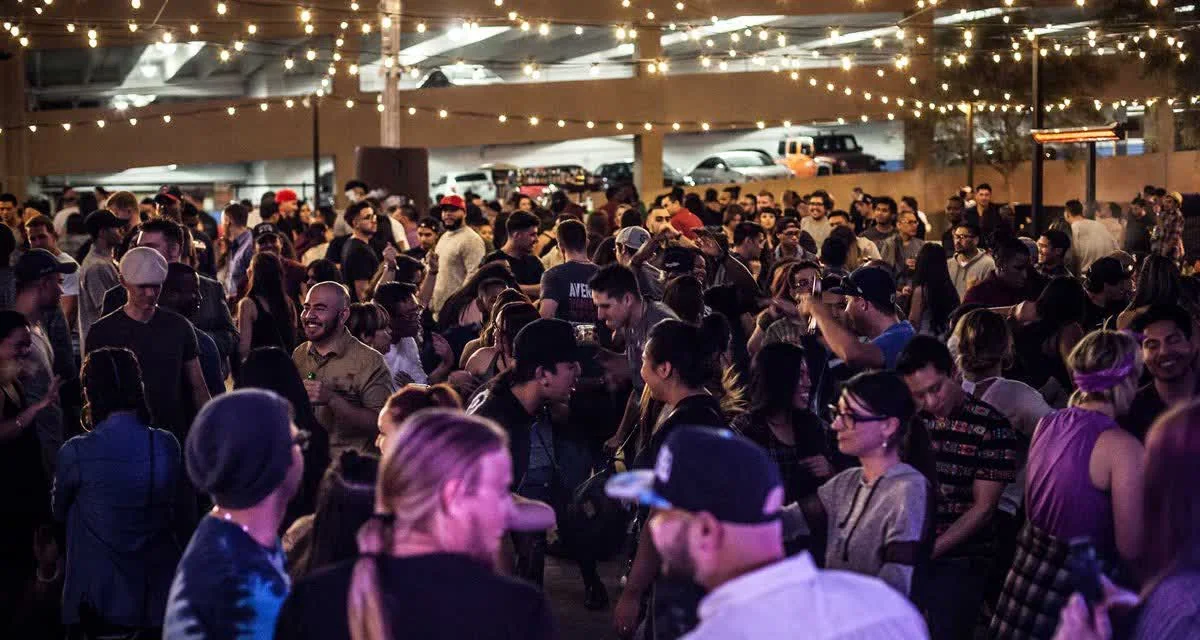The crowd under the string lights
