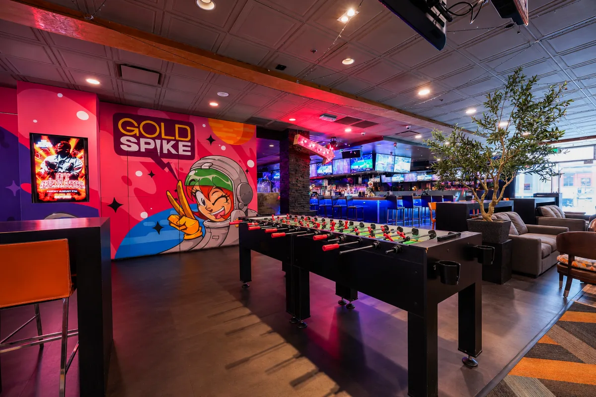 Foosball tables by the Gold Spike mural