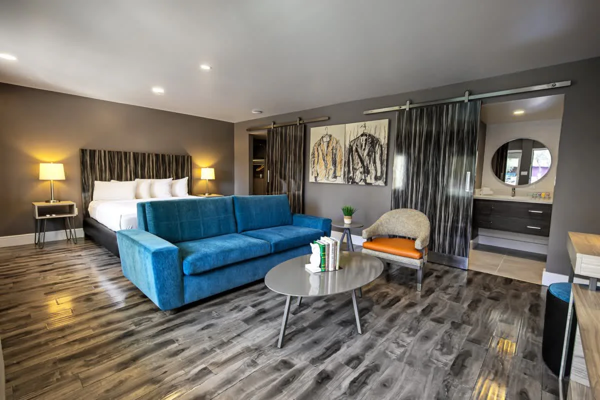 An Oasis suite with a blue velvet sofa